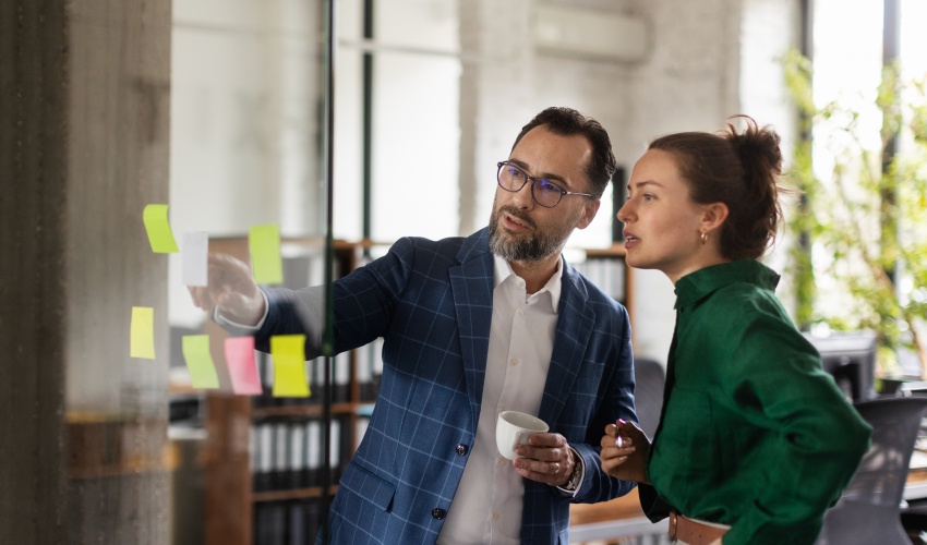 Young Man Showing Notes In Office To His Colleague 2023 11 27 04 50 12 Utc