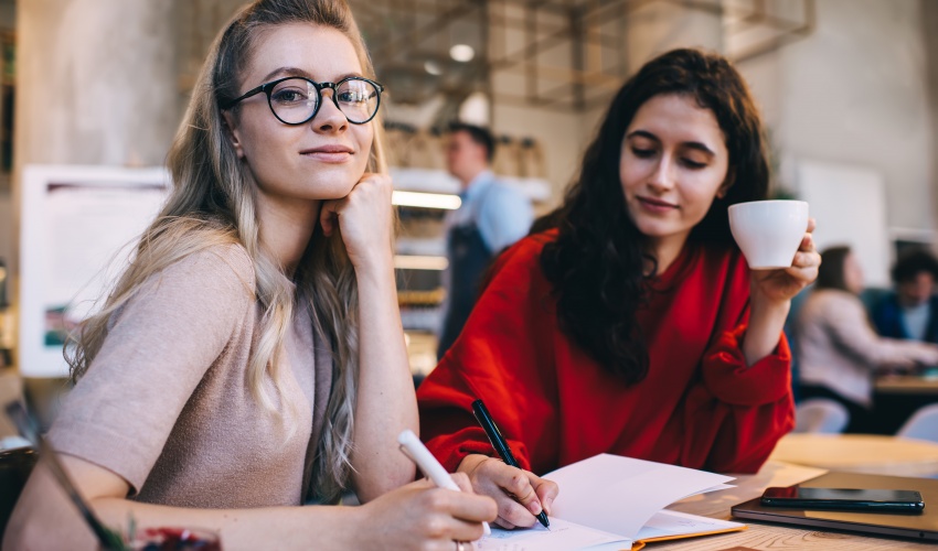 Woman Sitting With Coworker In Cafe 2023 11 27 04 51 17 Utc